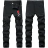 Man Stretch Rose Broderi Jeans Fashion Occident Trend Hole Fold Zipper Denim Byxor Designer Man Höst Ny Mid Midist Casual Slim Jeans
