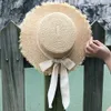 New summer sun hat bow 100%Raffia hat Visor Temperament flat Straw hats Women's Sea beach vacation leisure sunscreen hat Y200602
