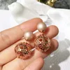 2019 New Style European and American Style Knotted Hollowout Pearl Fashion Female Dangle Stud Earrings Jewelry for Womans7319604