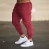 Mode nouveaux hommes Joggers marque mâle pantalon pantalons décontractés pantalons de survêtement survêtement gris décontracté élastique coton gymnases Fitness entraînement pan WE