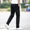 Весенние летние брюки мужчины мода мода бизнес растягивает мужские брюки чинос. Случайные черные хлопковые брюки Мужчина Pentalon Homme Mens 40 42 201128