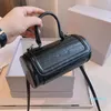 Designer- Små axelpåsar Metallformad Pull Ring krökad form på handväskor ryggsäck messenger lyxiga koppling läderväska