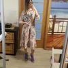 Nieuwe aankomst Vakantiejurk Women Fashion Long Sleeve Flower Print Geplooide jurk Elegant Woman Midi Holiday Dress T200603