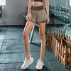 Sport Shorts Women Yoga Shorts Pchanie bioder Seksowne wysokiej zawartości siłowni fitness Elastyczne szybkie suche spodenki T200412