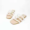 NXY Slippers 2022 nuevos zapatos de mujer al por mayor verano Pearl Beach zapatillas europeas y americanas transparentes de fondo plano sandalias abiertas 220125