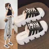 Cool slippers for women to wear out in summer: fashionable beach shoes with thick soles and high fashion straps