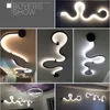 Nowoczesne kinkiety Led Curve oświetlenie dekoracyjne czarne zakrzywione światło Home Decor Bar Hall Hotel salon lampada a muro Factory Direct Sale