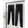2022 femmes pantalons mode décontracté Triangle métal motif imprimé pantalon noir respirant Leggings confortable classique Woemns Capris