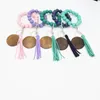 Moda Pulseras de cuentas de madera Borla de haya Llavero Colgante de fiesta Pulsera de cuero Llavero de mujer Llaveros de mujer Disco de muñeca de madera Anillos de cuentas