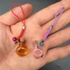 Small Glass Oblate Bottles with Mini Braided Nylon Rope Keychains Jars Pendants Mixed Color 7pcs