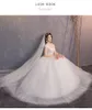 Eleganta bröllopsklänningar plus storlek bollkakor o-nacke cap ärm lace applikationer billiga illusion brud klänningar vestidos de noiva 2020