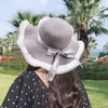 Cappelli estivi per donna Visiera parasole in paglia Tesa larga Pieghevole Cappello da spiaggia da donna Cappellino protezione solare Cappellino con fiocco femminile Cappello moda donna G220301