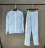 2024 NYA MENS DESIGNERS TRACKSUD Kvinnor Casual Baby Blue Sweatshirts Fashion Men Outdoor Jogging Sportswears Luxurys Play Clothes Par Suits kläder