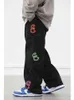 Retro multi pocket letters print rechte jeans mannen vrouwen oversize baggy denim broek wit zwart harajuku streetwear broek g0104