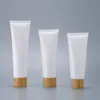 Nyemokvitt vit plastpressonflaska Kosmetisk krämburkar Refillable Travel Lip Balm Container med bambu keps RRD12851