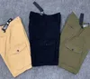 23SS Vår Sommar Cargo Shorts Herr Kvinnor Militärstil Bomull Multi Pocket Casual Kompass Badge Broderi 042501