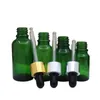 Flacone contagocce per imballaggio cosmetico in vetro verde Anello in argento dorato Top in Rebber nero Fiale ricaricabili per olio essenziale cosmetico vuoto 5ml 10ml 15ml 20ml 30ml 50ml 100ml