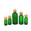 Botella de gotero de vidrio de escarcha 10ml 15ml 20ml 30ml 50ml con tapa de bambú tapa botellas de aceite esencial verde helada