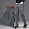 Inverno estilo clássico homens marca jeans negócio casual estiramento calças de denim luz azul calças pretas masculino com mais tamanho