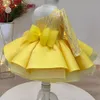 Abito da tutù per bambina di fiore giallo brillante 2022 Manica lunga Una spalla Principessa Neonata Abiti da spettacolo Gonfio Prima comunione Compleanno Abiti da festa formale Paillettes Raso