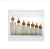 Bottiglia di vetro bianco opale da 15 ml 30 ml 50 ml con contagocce di bambù Bottiglia di olio essenziale di bambù da 1 OZ Vetro opale