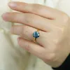 blue moissanite ring.