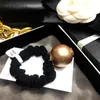 3CM Accessoires de cheveux de luxe grosse corde de cheveux de perle avec des timbres pour dames Boules pneu Cravate de cheveux de mode avec sac en filet et papier ca211k