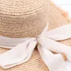 New summer sun hat bow 100%Raffia hat Visor Temperament flat Straw hats Women's Sea beach vacation leisure sunscreen hat Y200602