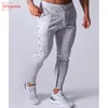 SITEWEIE Pantaloni sportivi Uomo Running Gym Cotton Pencil Pants Pantaloni da jogging Casual Fitness Pantaloni sportivi in cotone Bodybuilding Pantaloni G249 201128