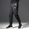 Męskie spodnie na zewnątrz mężczyzny Nosić czarną białą kaczkę w dół małego typu stóp talii zagęszczanie w czystym kolorze rozrywki ciepłe spodnie1