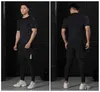 Man sportswear dresset zestaw rajstopy do biegania fitness MMA Sport Suit Scent Koszykówka Legginsy Koszulka 2-PC / zestaw Man Y1221