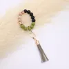 Wholesale foreign trade food grade silicone beads wrist keychain alloy cap PU leather tassel keychain female multicolor optional