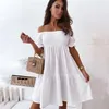 Kvinnor Sexig rygglös miniklänning Summer Fashion Lady Slash Neck White Puff Sleeve Big Swing Party Beach Dresses Casual Robe Femme 220210