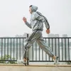 Dorosły bieganie sportowe Zestaw Rain Coat Student Student Hooded Sports Suit Large Size Męski garnitur sportowy Zestaw Rasu przeciwdeszczowego Lekki R5C128 201015