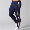 Hommes rayé Zipper pantalons de survêtement mode tendance sport Gym crayon pantalon concepteur mâle automne nouveau cordon décontracté droit maigre pantalon