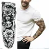 Un uomo e una donna con il braccio completo e la gamba oversized tatuaggio temporaneo e il corpo art # 76