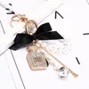 2021 New Imitation Pearl Perfume Bottle Keychain Car Ring Holder Bag Charm Pendant Accessories Bow Key Chain Fashion Keyring303530274u