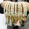 European and American creative fashion beaded pearl bracelet PU leather tassel copper pendant keychain factory direct sales
