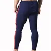 Hommes rayé Zipper pantalons de survêtement mode tendance sport Gym crayon pantalon concepteur mâle automne nouveau cordon décontracté droit maigre pantalon