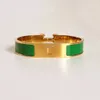 Högkvalitativ designer Design Bangle rostfritt stål Guldspänne armband smycken män och kvinnor armband