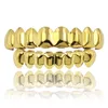 Hip Hop Gold Grillz Trendyy Miljö Smooth Gold Plated Dental Grills Hela Halloween tänder hängslen 2 -stycken Set2077845