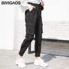 BIVIGAOS Nouvelles femmes Harajuku Pantalons cargo élégants Coréens Salopette Tendance Mode Casual Slim Harem Pantalon MAGIC TAPE Neuvième pantalon LJ201030