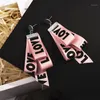 boucles d'oreilles ruban rose