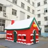 Tenda Gonfiabile Di Natale All'aperto 6m Casa Rossa Soffiata Ad Aria Cottage Gigante Del Villaggio Di Natale Per La Decorazione Di Natale Invernale