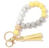 Favore di partito 9 colori Nappa di legno Perline Bracciale con cordino Portachiavi Perline in silicone per uso alimentare Braccialetti Donna Ragazza Portachiavi Cinturino da polso SN3134