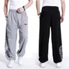 Streetwear Autunno Primavera Cotone Allentato Uomo Pantaloni Harem Mens Sweatpant Pantaloni Hip Hop Uomo Plus Size Abbigliamento Parkour Pantaloni 201109