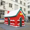 Tenda Gonfiabile Di Natale All'aperto 6m Casa Rossa Soffiata Ad Aria Cottage Gigante Del Villaggio Di Natale Per La Decorazione Di Natale Invernale