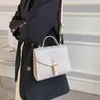 Handväska låsning hand höst ny signatur sling axel messenger liten fyrkantig kvinna väska