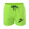 Hommes décontracté séchage rapide pantalons courts poches plage marque LOGO blanc noir Sport Shorts hommes été homme pantalon avec poche respirant