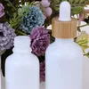 Empty White Porcelain Dropper Bottles Vials 10ml 15ml 20ml 30ml 50ml 100ml with Bamboo Cap for Essential oils Cosmetics Packing